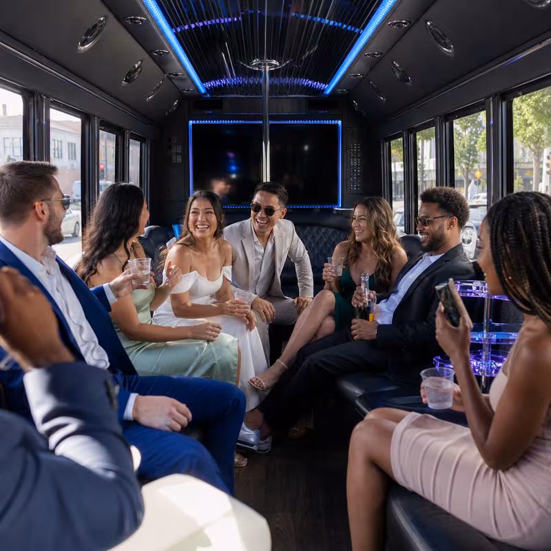 Party bus interior with wraparound leather seating and LED lighting in Pasadena
