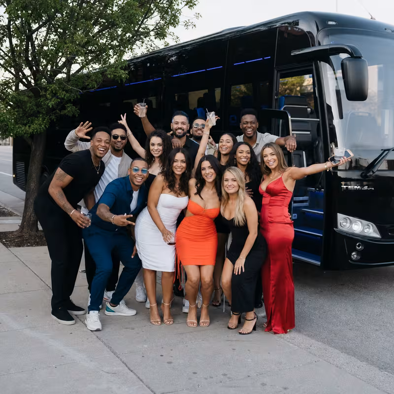 Group boarding a white charter bus for Birthday Transportation transportation in Pasadena