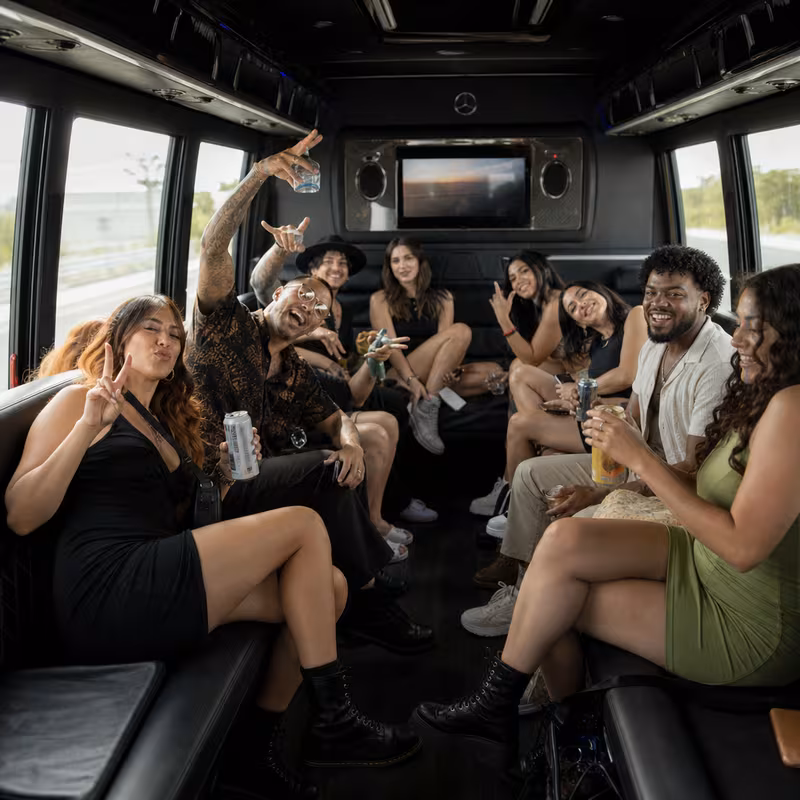 Group boarding a white charter bus for Concert Transportation transportation in Pasadena