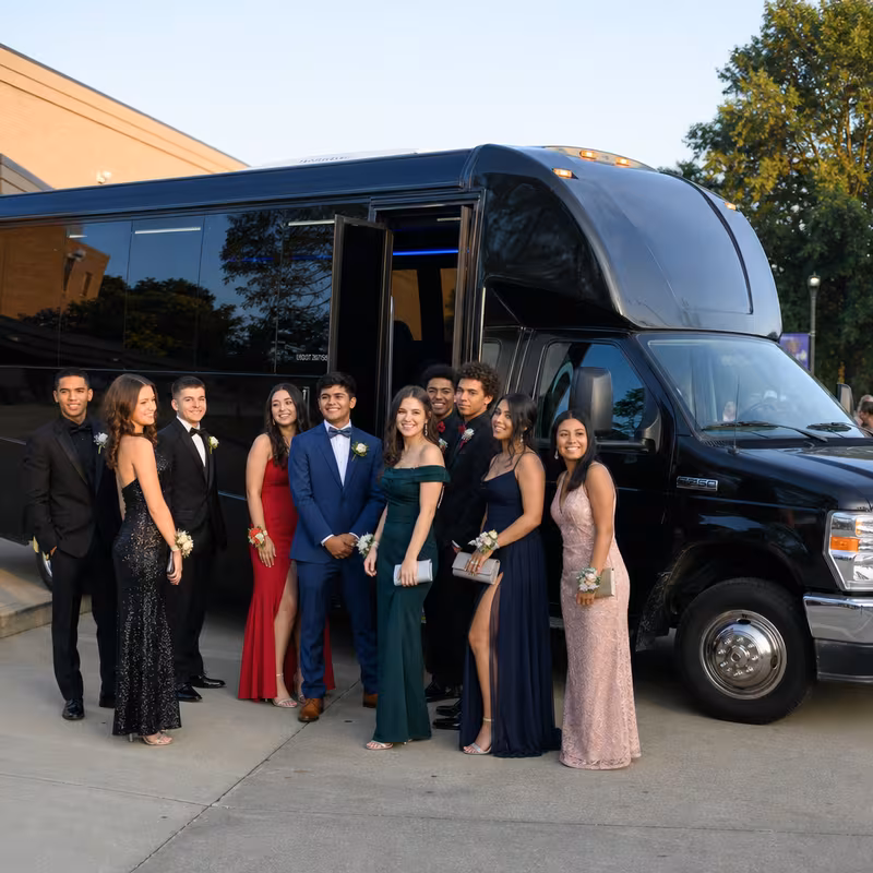 Group boarding a white charter bus for Prom & Homecoming Transportation transportation in Pasadena