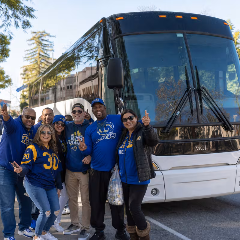 Passengers loading luggage while boarding an Pasadena group shuttle