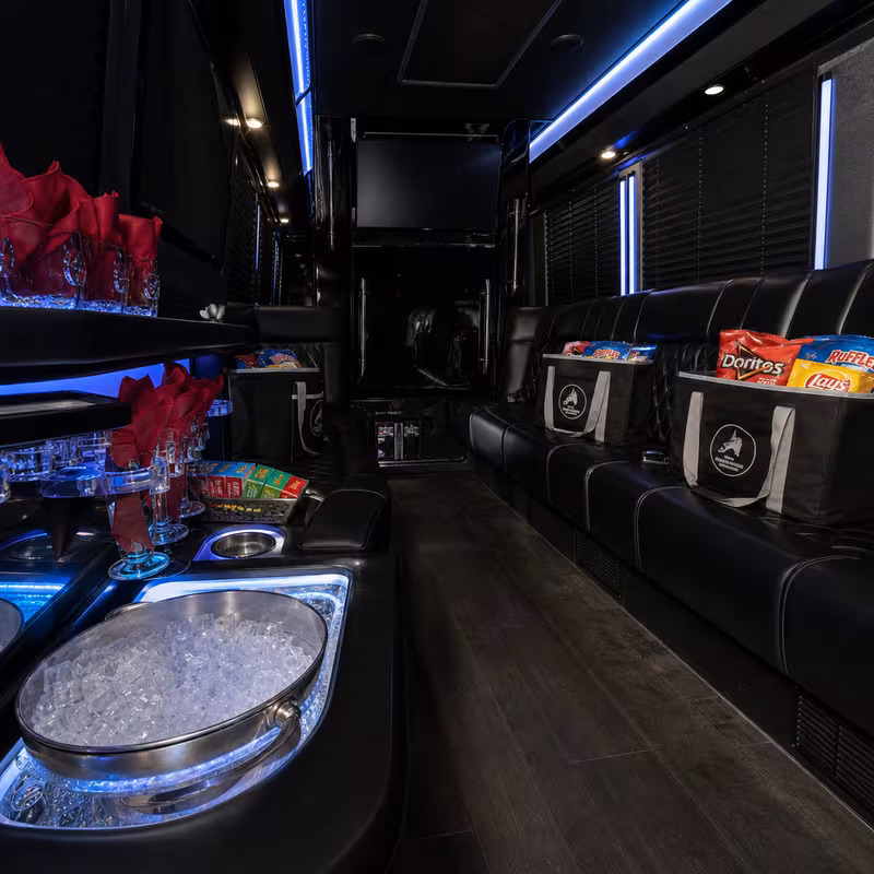 Party bus interior with wraparound leather seating and LED lighting in Pasadena
